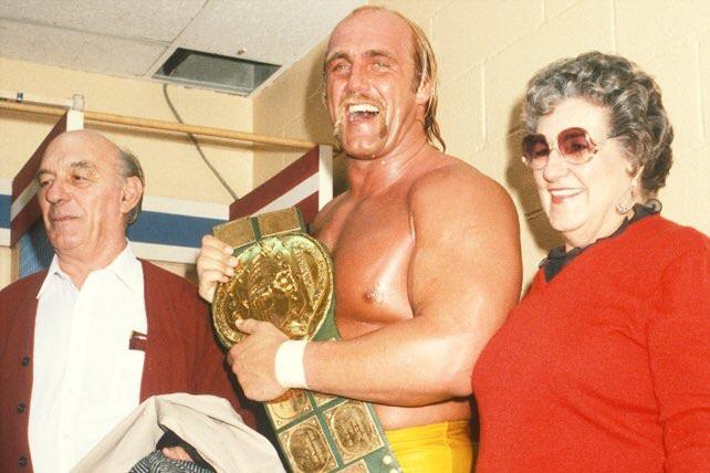 A new champ celebrates victory with his parents.